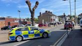 Police shut off road near Leigh supermarket as all emergency services on scene