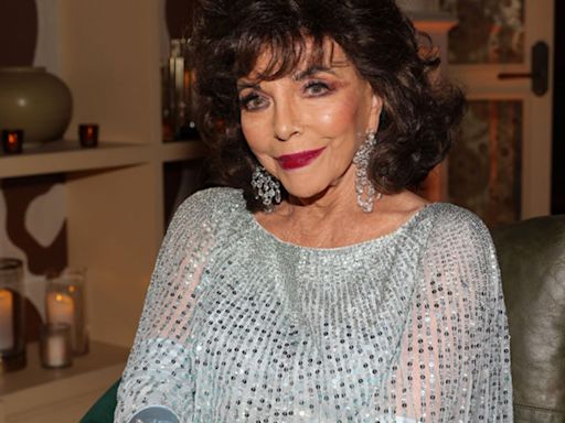 Joan Collins, 91, is ageless in printed midi dress and heels