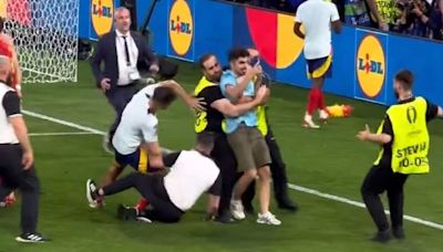 Spain's Alvaro Morata suffers injury scare after security guard slides into him during celebrations