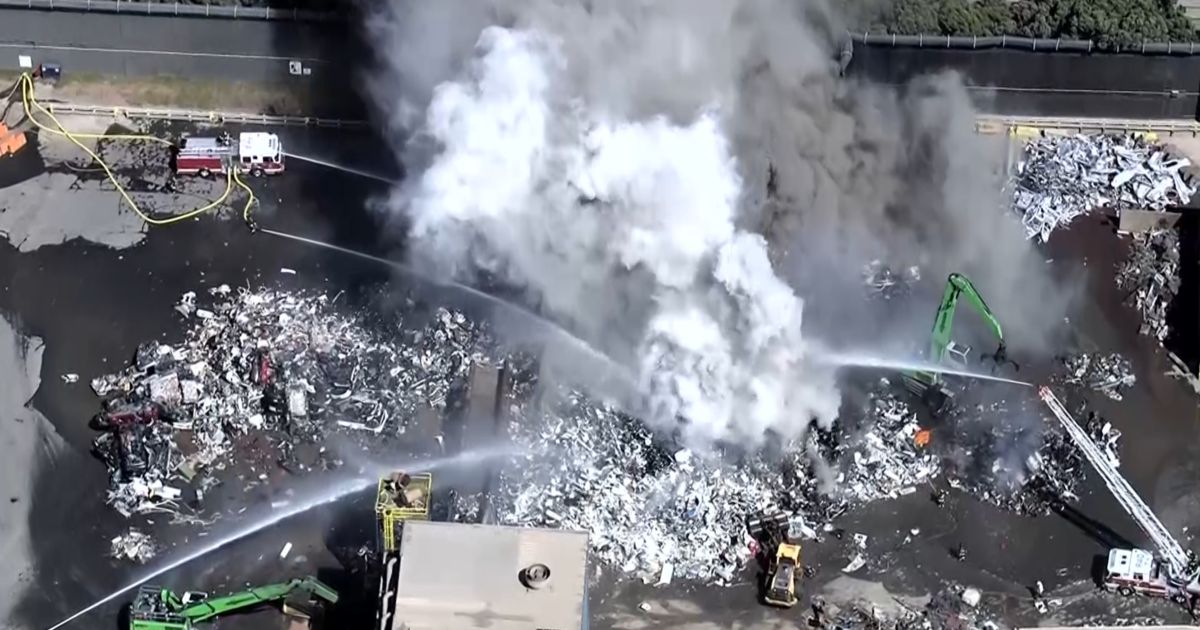 Watch live: Fire burns at Redwood City metal recycling plant, producing huge plume of smoke