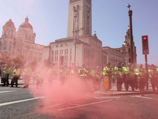 Liverpool riots: First group of people involved in riots appear in court - with one swearing as he was taken away