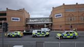 Woman among six injured after crash outside shopping centre