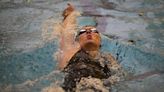 While Simone Biles competes across town, Paralympic star Jessica Long rolls at swimming trials