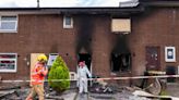Forensic officers comb flat as man arrested after suspected arson attack
