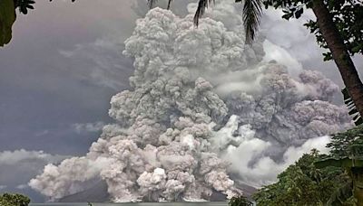 Indonesia’s Ruang volcano spits more hot ash after eruption forces schools and airports to close