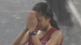 Video of Cambodian woman finishing 5000m race in pouring rain goes viral