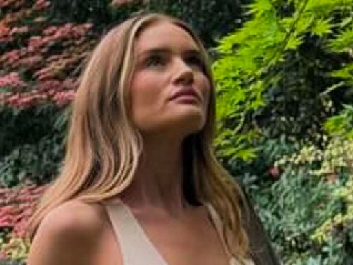 Rosie Huntington-Whiteley puts on a busty display as she goes braless