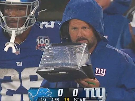 Brian Daboll explains why he used a plastic clipboard tent to protect his play sheet in the rain