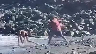 Shocking moment beachgoer is beaten with parasol stick on Tenerife beach