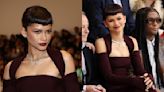 Zendaya Matches Maroon Cold-shoulder Dress to New Baby Bangs Hairstyle at Fendi Couture Spring 2024 Fashion Show
