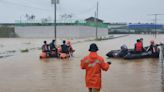 Live: Rescue crews attend scene of flooded South Korea underpass