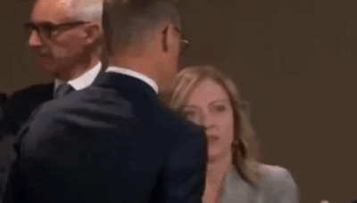 Watch: Giorgia Meloni rolls eyes, checks non-existent wrist watch as Biden is late - Times of India