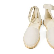 Espadrilles are slip-on sandals that feature a canvas or cotton upper and a jute sole. They are often worn in the summer and can be dressed up or down depending on the style. They come in a variety of colors and patterns and can be found with or without ankle straps.