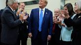 Cheers, cake and a fist-bump from GOP as Trump returns to Capitol Hill in a first since Jan. 6 riot