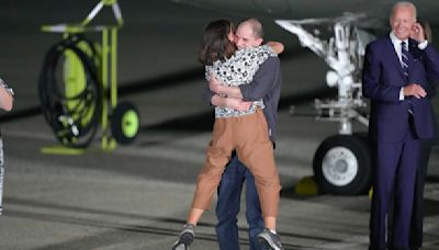 Emotional photos show moments Evan Gershkovich, Paul Whelan are reunited with loved ones on American soil after being free from Russian detainment