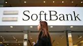 Japan's SoftBank Group trims investment losses but remains in red for fiscal year