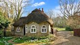 Tiny cottage with arched thatched roof for sale on the Isle of Wight