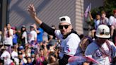 Chugging beer and raising a trophy, see what Texas Rangers World Series championship parade looked like