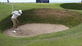 Thomas steadies himself in the wind and rain at Troon for early British Open lead