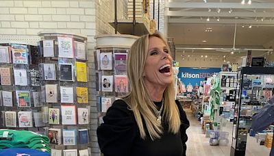 Cheryl Hines checks out her new line of candles at LA boutique Kitson