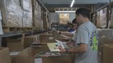 Employees at Lexington business spend ‘Impact Day’ working to send books around the world