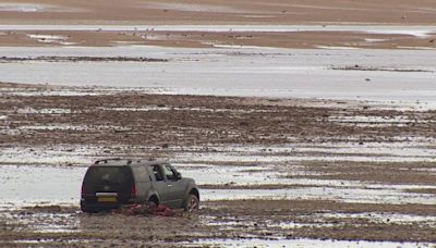 Car stranded on beach still to be removed