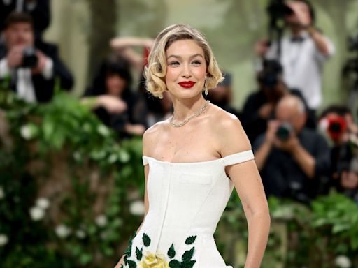 Gigi Hadid Goes Retro in a Floral White Tiered Dress at the 2024 Met Gala