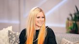 Avril Lavigne looks 'breathtaking' wearing pink Versace cardigan in new pics