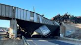 Truck driver killed when train derailment collapses Colorado bridge, spilling coal cars onto highway