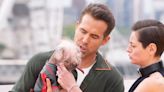 Ryan Reynolds pictured holding Dogpool at Deadpool and Wolverine photo call