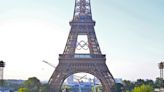 Olympic rings displayed on Eiffel Tower ahead as Paris Games near