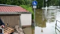 German Chancellor Olaf Scholz drew links to climate change as he visited flood-hit areas in southern Germany