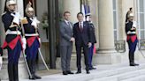 France and Japan agree to start talks on military cooperation deal