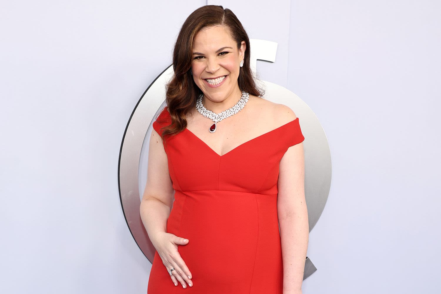 Lindsay Mendez Cradles Her Baby Bump in Red Hot Gown at the 2024 Tony Awards