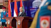 Hungary's Prime Minister Viktor Orban receives a medal from pro-Russia Bosnian Serb president Dodik