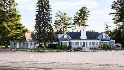 Grand Traverse Bay beach house with 235 feet of sugar sand frontage for sale