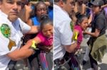 Chaotic video shows NYC Parks employee cuff girl, 14, selling fruit with family as bystanders try to pull her away