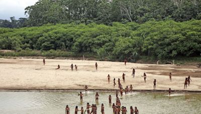 Group says photos of reclusive tribe on Peru beach show logging concessions are 'dangerously close'