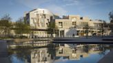 Climate protesters spray Scottish Parliament building red