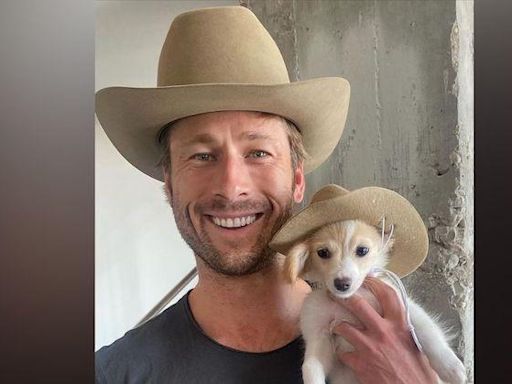 Glen Powell Leaves Little to the Imagination as He Poses With His Dog Brisket in Steamy Shirtless Photo