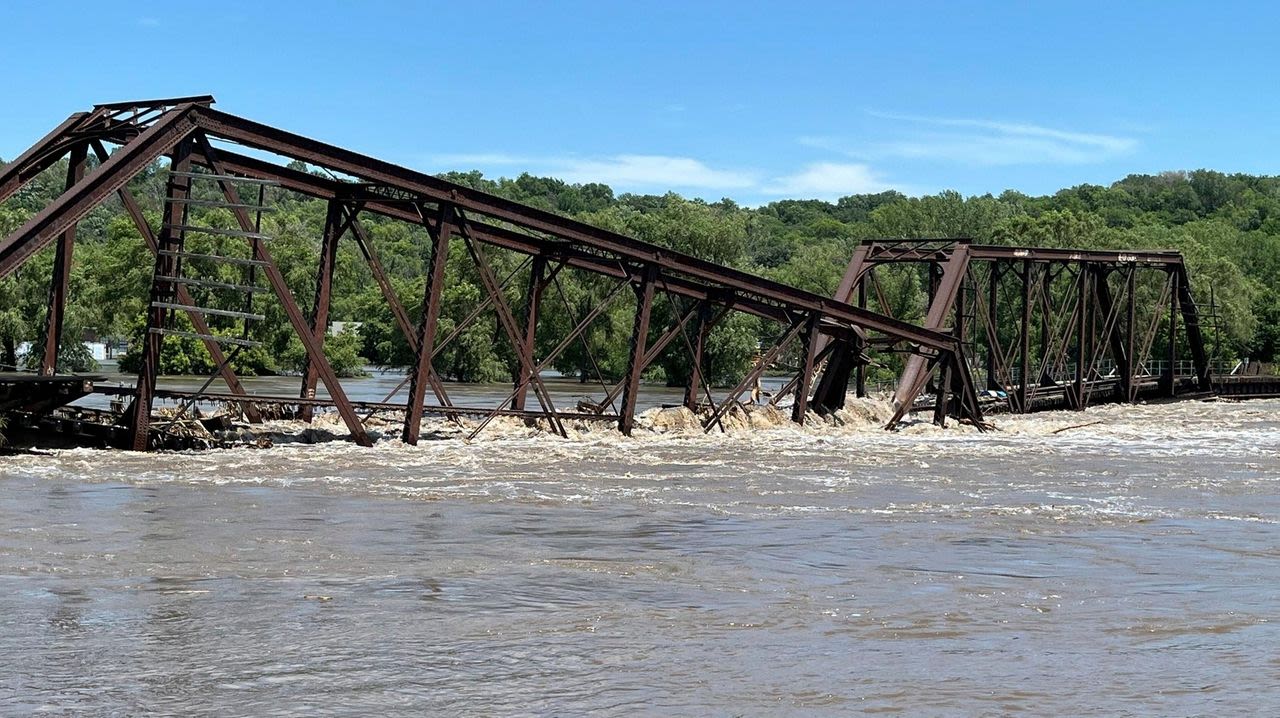 Midwest flooding collapses rail bridge, forces evacuations, kills at least 2