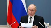 Vladimir Putin 'probably has Parkinson's disease', ex-MI6 boss says