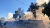 Multiple explosions heard as three homes burn in Redding fire