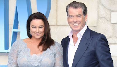 Pierce Brosnan's wife looks radiant in all white as she's reunited with 007 star