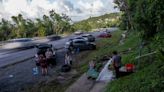 Bermuda hunkers down as Hurricane Fiona looms, powerless Puerto Rico swelters