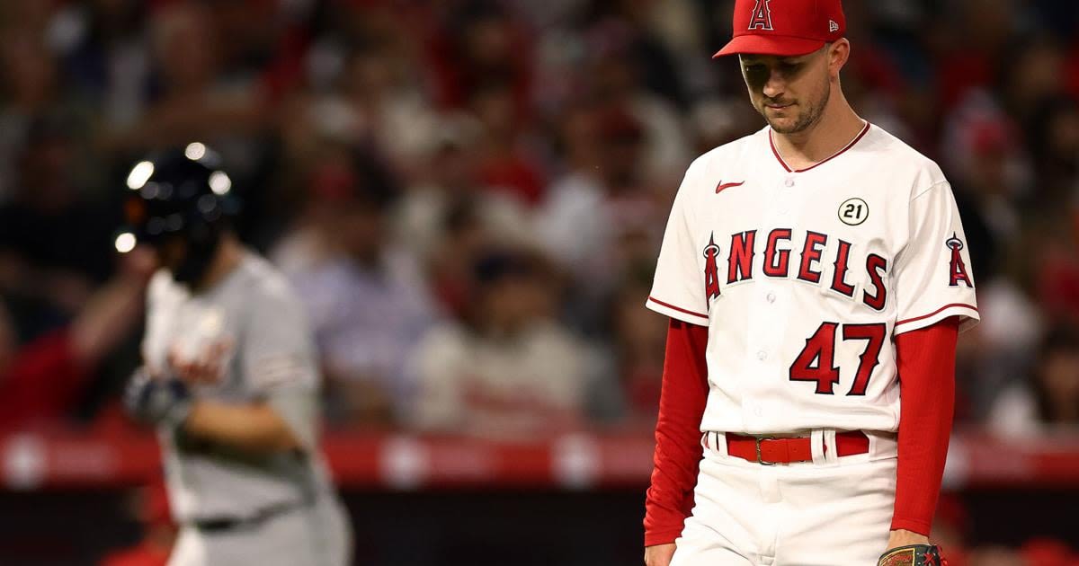 ...Angeles Angels pitcher Griffin Canning reacts after giving up a home run to the Detroit Tigers' Jake Rogers, left, during the sixth inning at Angel Stadium of Anaheim on...