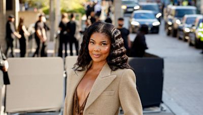 Gabrielle Union Ties Together Earthy Fall Outfit With Bay Sandals at Burberry’s Spring/Summer 2025 Show at London Fashion Week