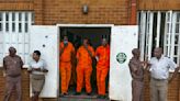 Election officials in South Africa rush to register 100,000 prisoners to vote