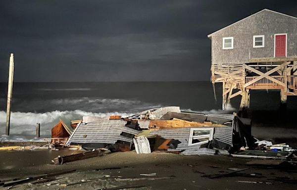 A house in Rodanthe, North Carolina collapses into the ocean