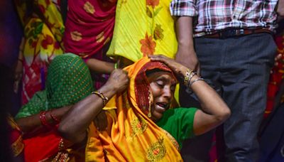 Six organisers arrested after crush at religious event in India kills 121